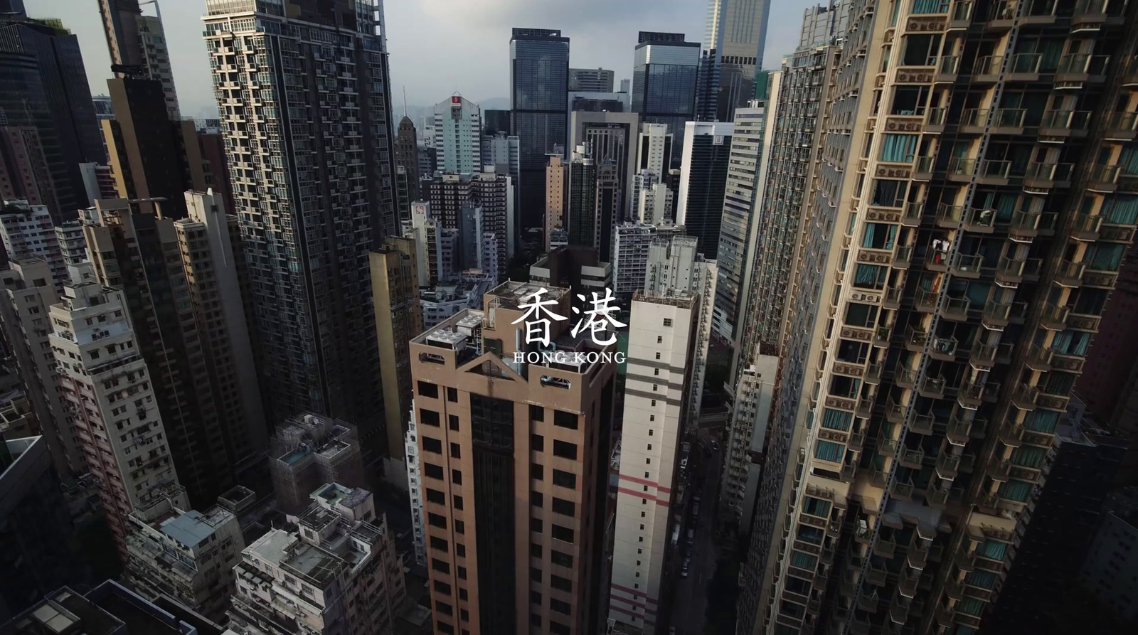 an aerial view of a city with tall buildings