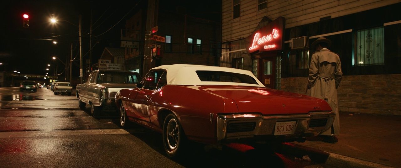 a red car parked on the side of the road