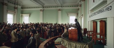 a crowd of people in a large room