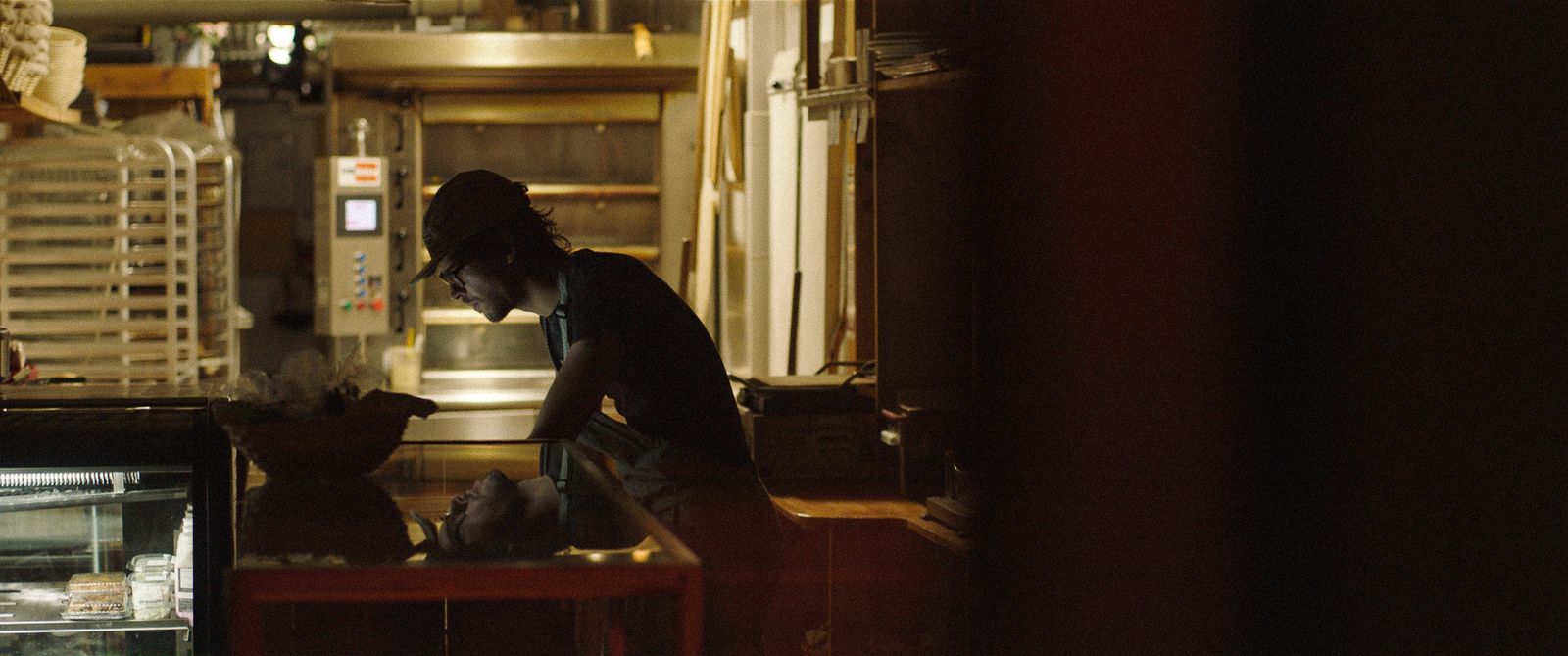 a man standing in a kitchen preparing food