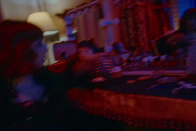 a blurry photo of a woman sitting at a table