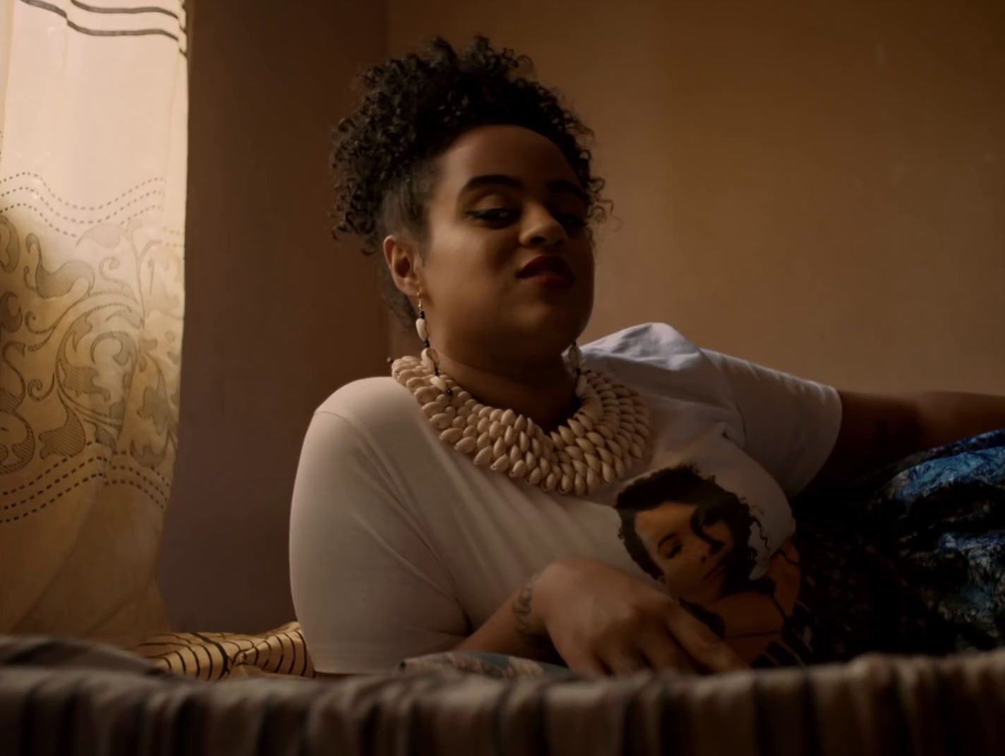 a woman sitting on a couch holding a doll