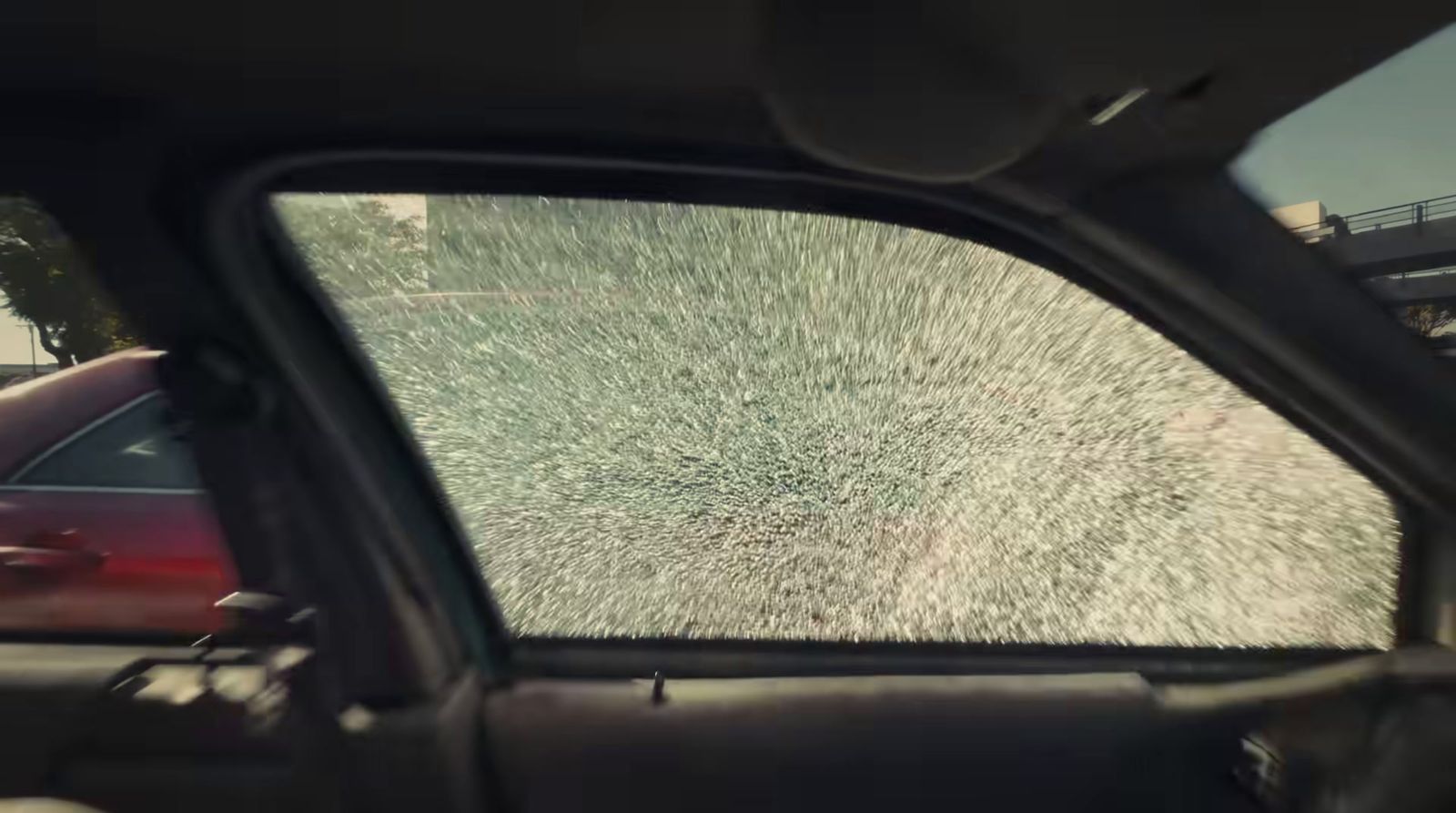 a view of a car's rear window from inside a vehicle