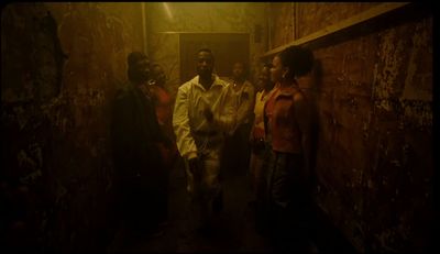 a group of people standing in a hallway