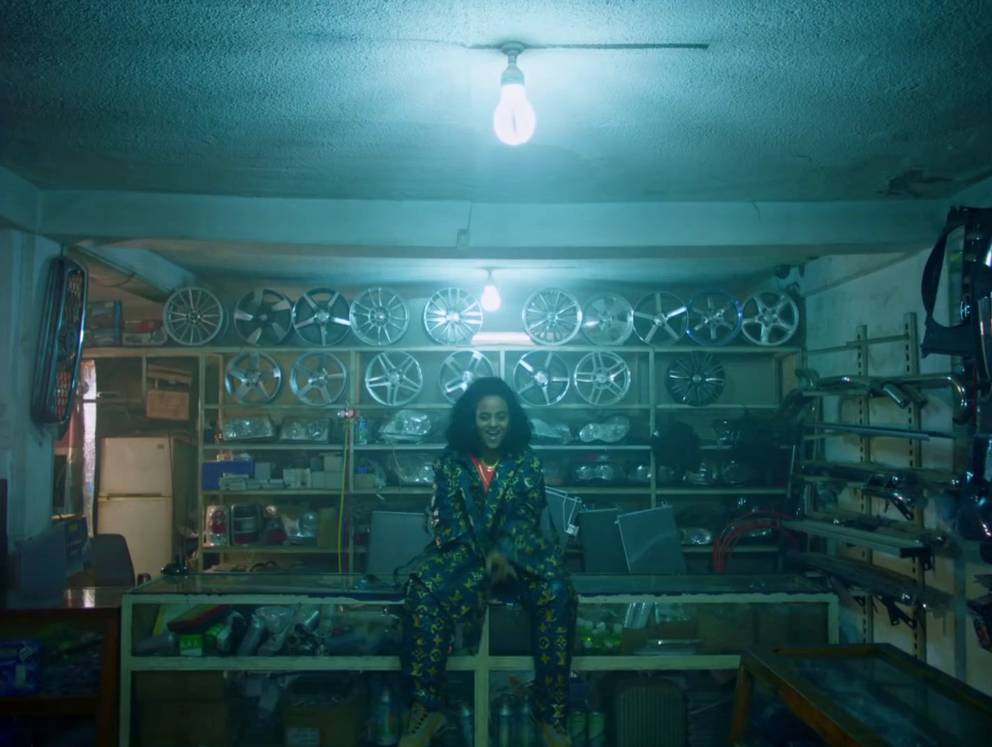 a woman sitting on top of a table in a room