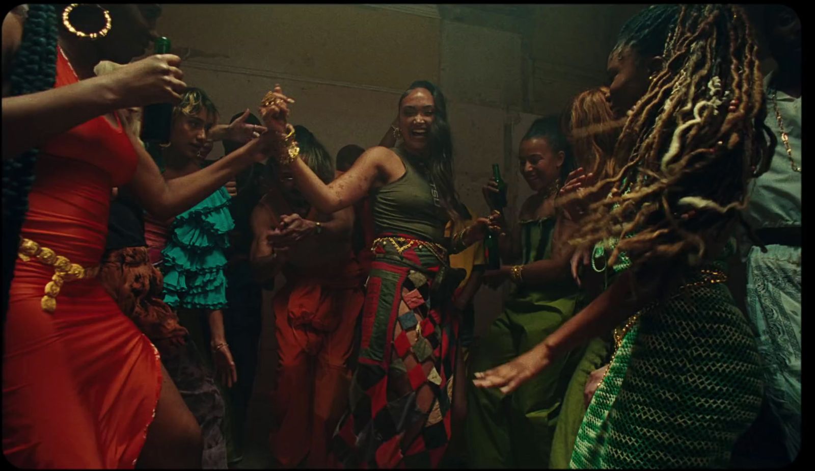 a group of women dancing around each other