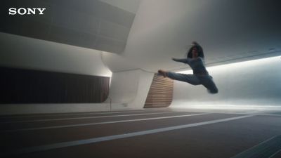 a person jumping in the air in a room