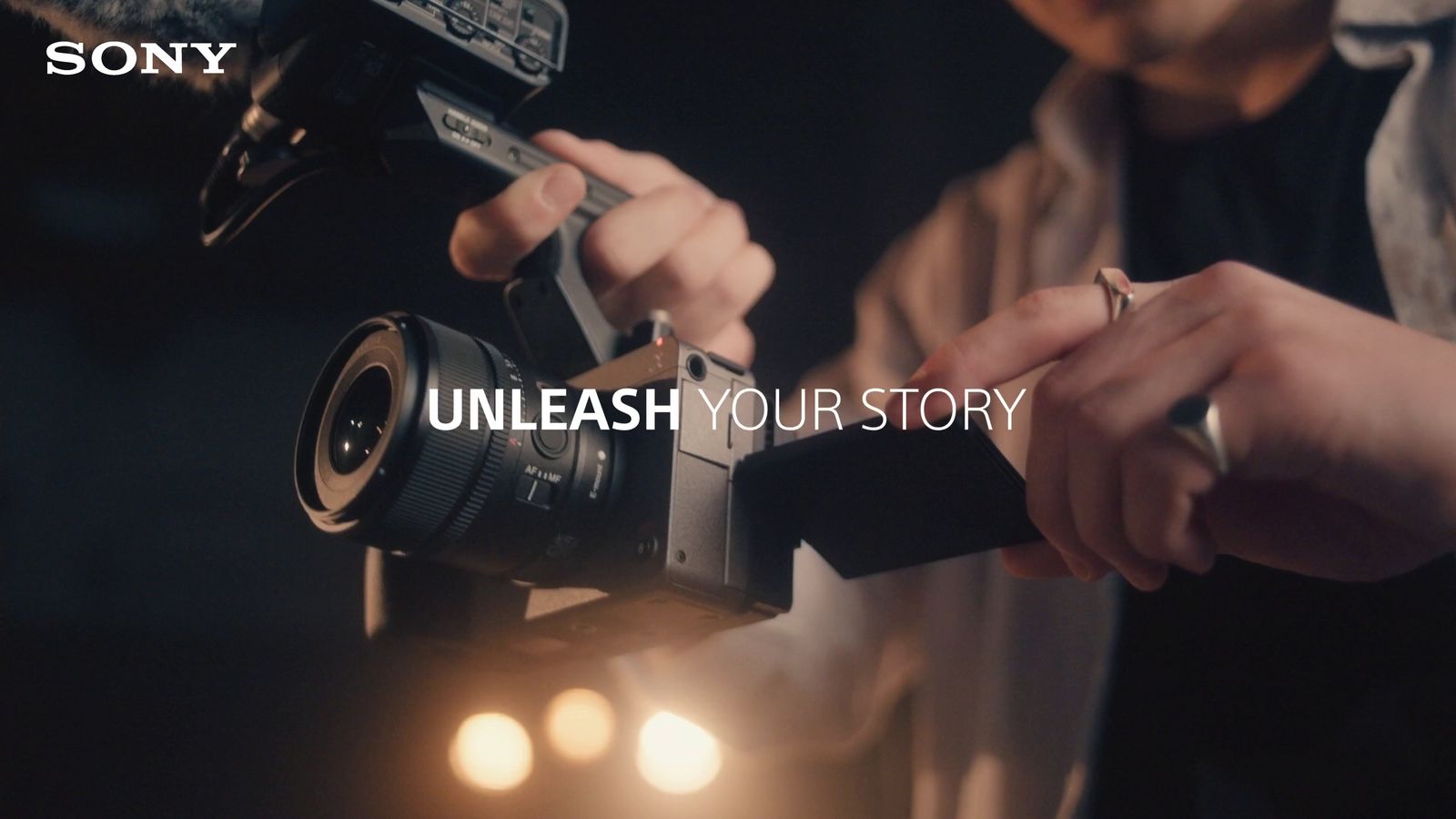 a person holding a camera with the words unleash your story