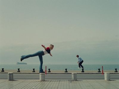 a person doing a trick on a skateboard near the ocean