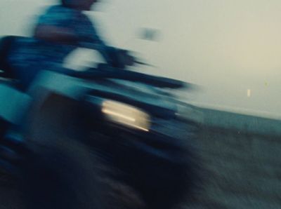 a blurry photo of a person riding a motorcycle