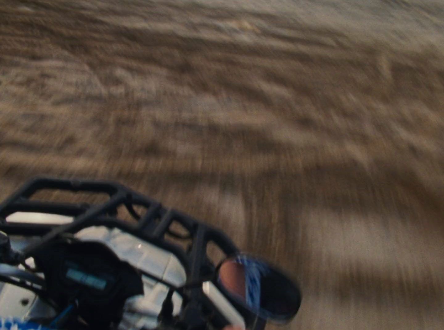 a person riding a motorcycle on a dirt road