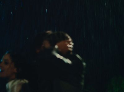 a man and a woman standing in the rain