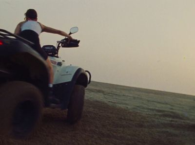 a person riding a four wheeler in the desert