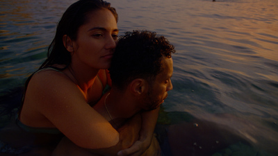 a man and a woman in a body of water