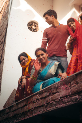 a group of people standing on top of a brick wall