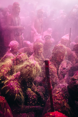 a group of people covered in colored powder