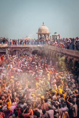 a crowd of people standing around each other