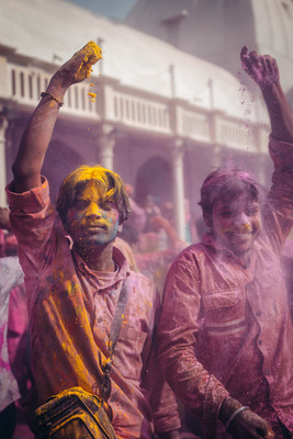 a group of people covered in colored powder