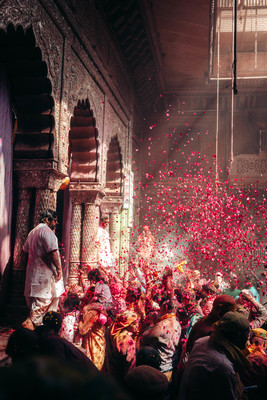 a group of people standing around a building