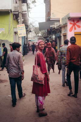 a group of people walking down a street