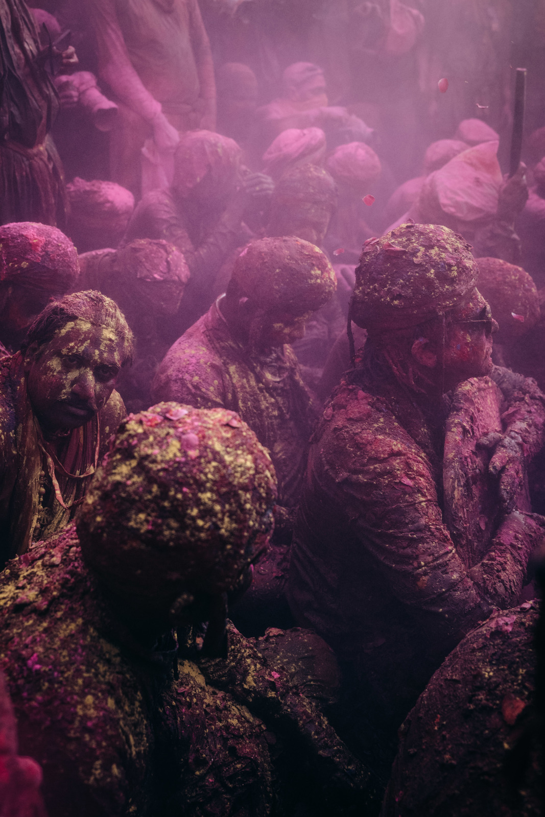 a group of people covered in colored powder