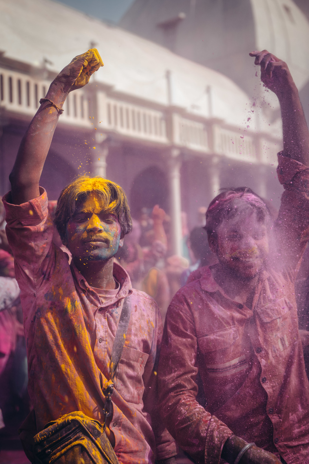 a group of people covered in colored powder