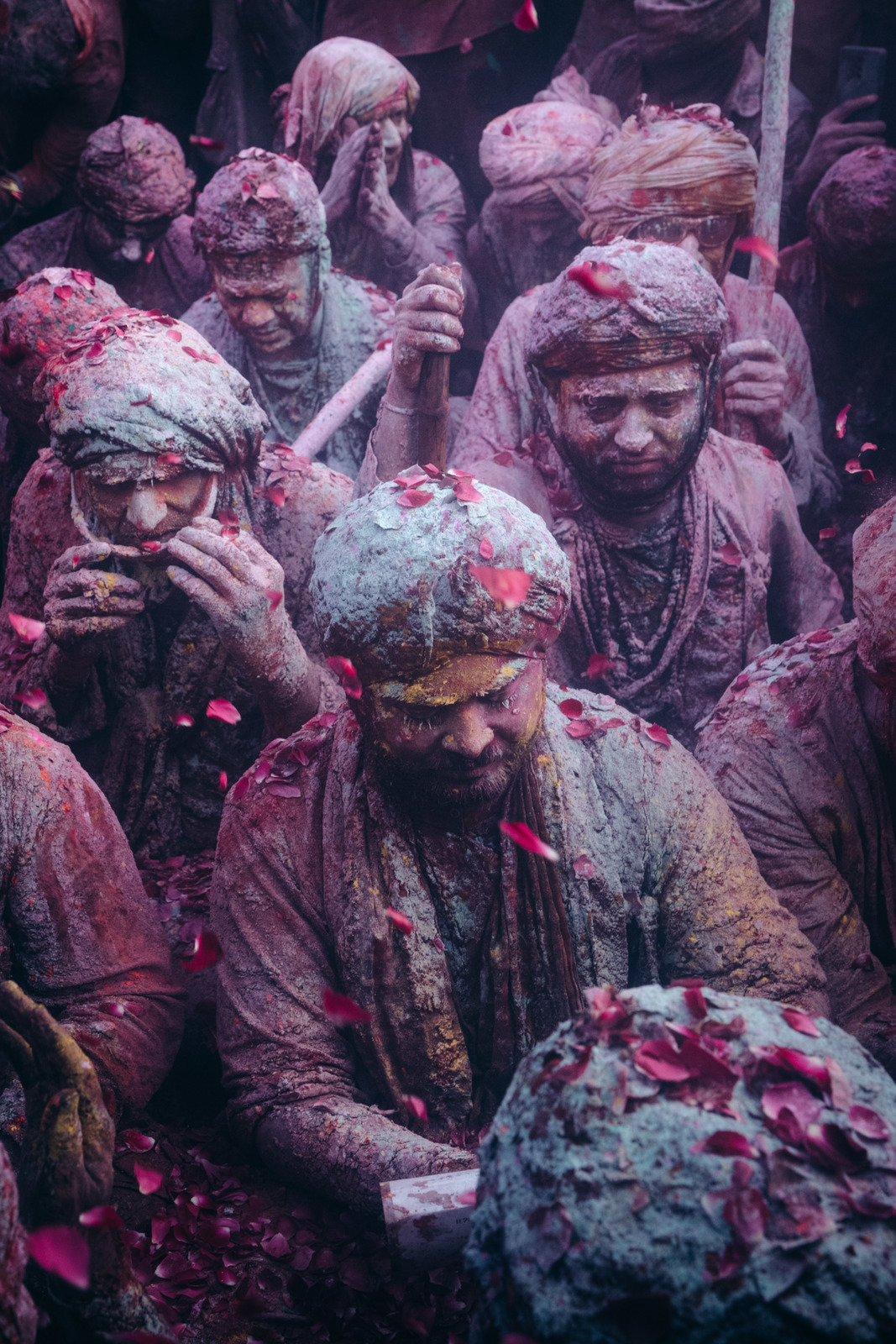 a group of people covered in colored powder