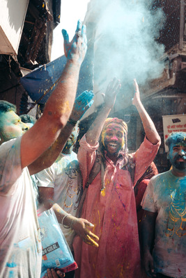 a group of people covered in colored powder