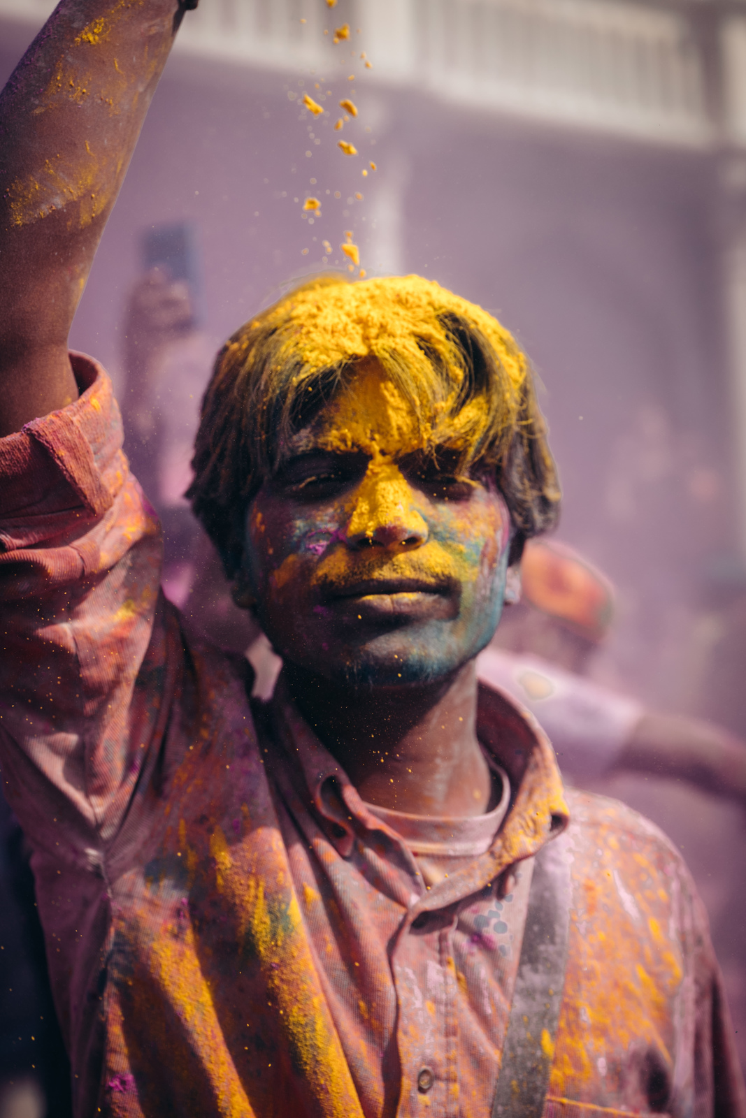 a man with yellow paint on his face