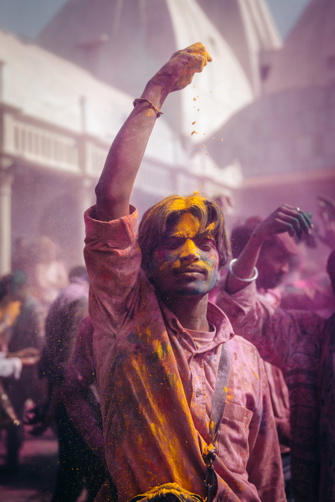 a man with yellow paint on his face and arms