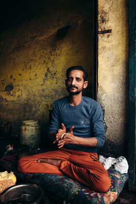 a man sitting on the floor in a room