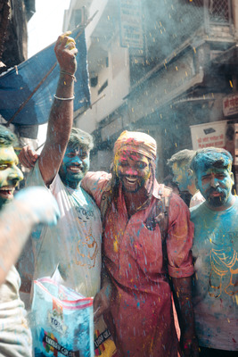 a group of people covered in colored powder