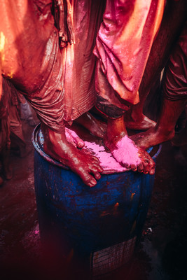 a close up of a person standing on a bucket