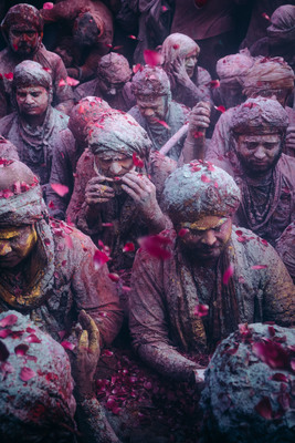 a group of people covered in colored powder