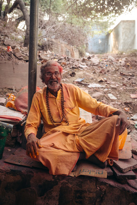 a man sitting on top of a pile of rubble