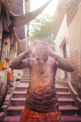 a man standing on a set of stairs covered in mud