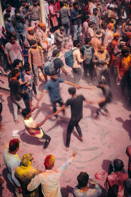 a group of people standing around a crowd of people