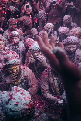 a group of people covered in colored powder