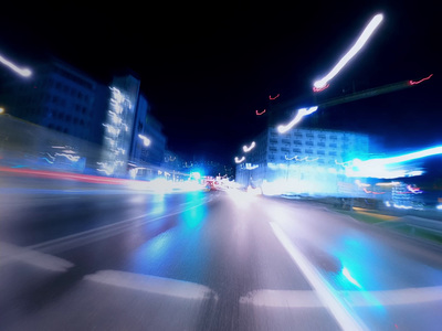 a blurry photo of a city street at night