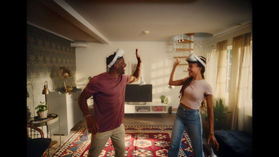 a man and a woman standing in a living room