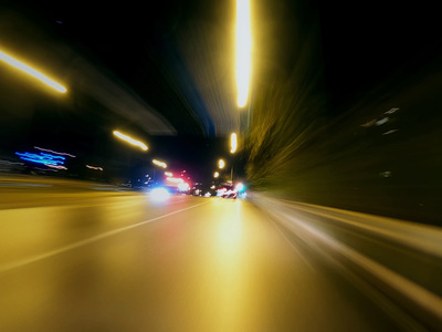 a blurry photo of a city street at night