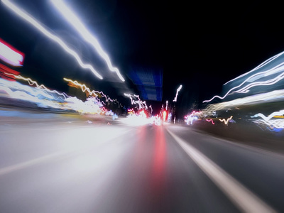 a blurry photo of a city street at night