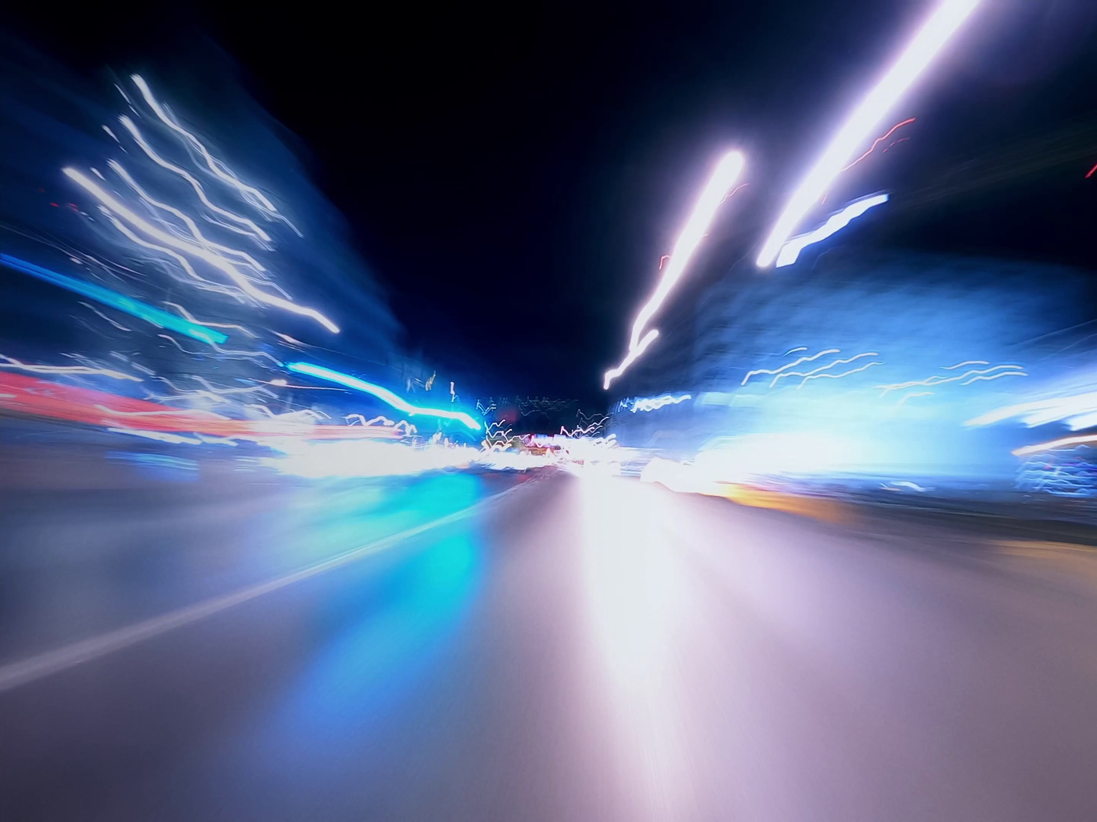 a blurry photo of a city street at night