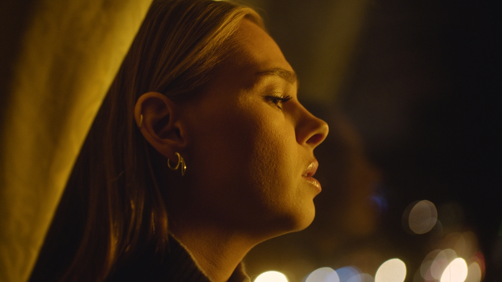 a close up of a person with a earring