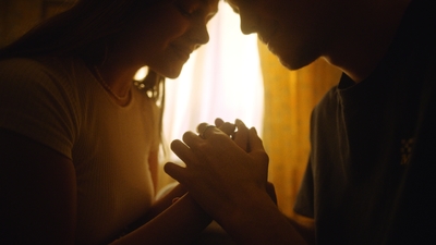 a couple of people that are praying together