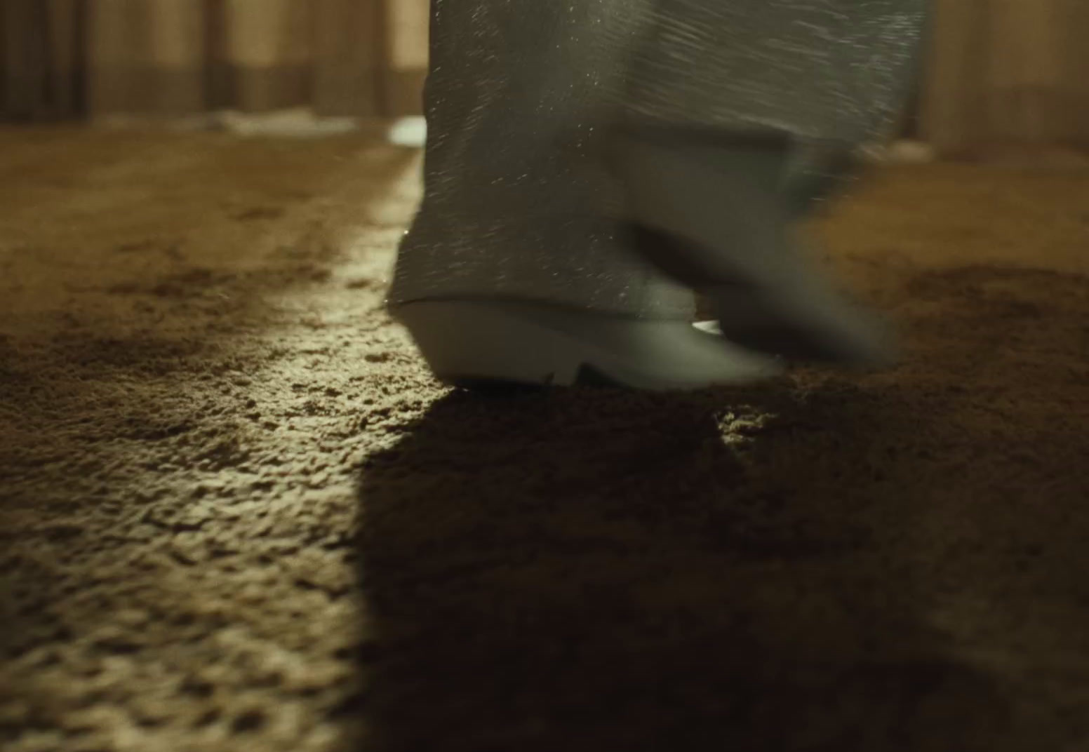 a close up of a person's shoes on the floor