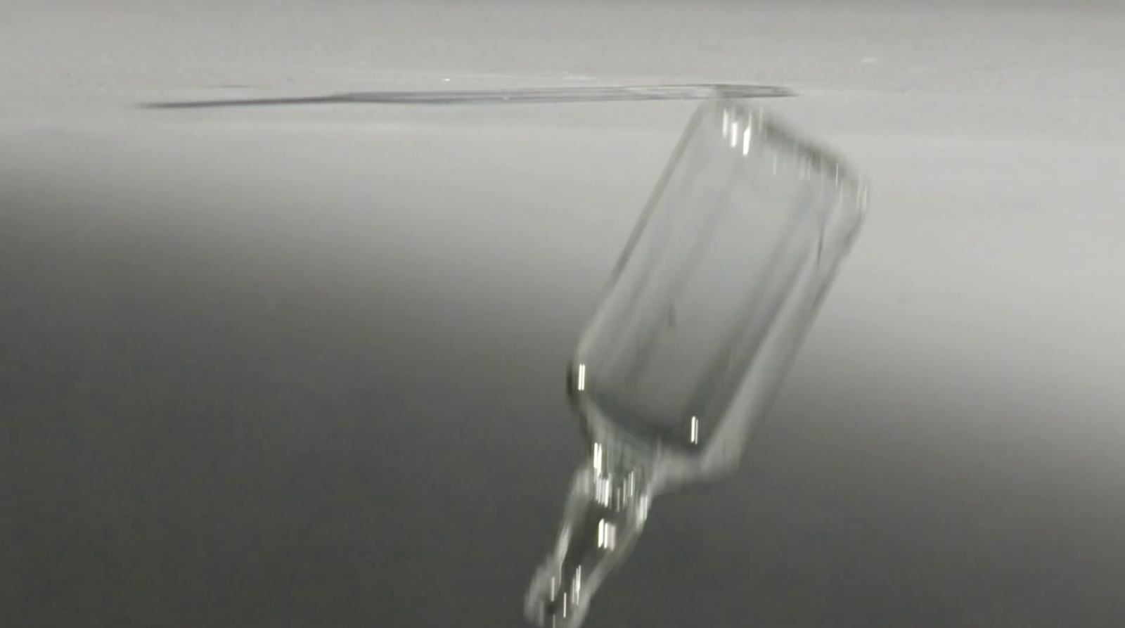 a drop of water falling from a faucet