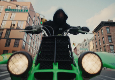 a person riding a motorcycle on a city street