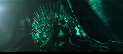 a woman is sitting on a iron throne