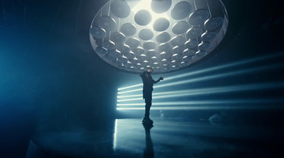 a person standing in front of a large object